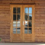 Double Glazed Timber Doors on a log cabin