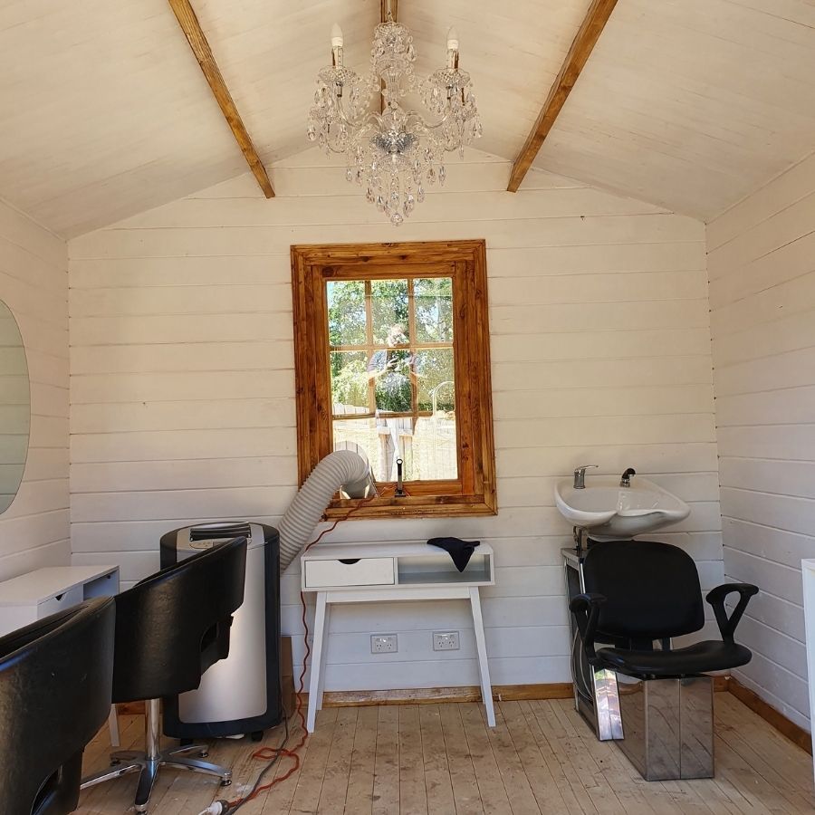 Hair dressing salon in Paulas backyard log cabin