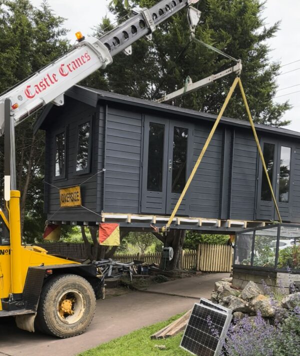Star Deluxe Cabin being relocated with a crane